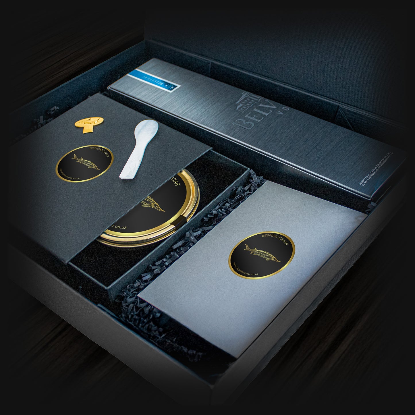 Dark hamper featuring Belvedere Vodka, caviar tin, mother of pearl spoon and a caviar tin opener