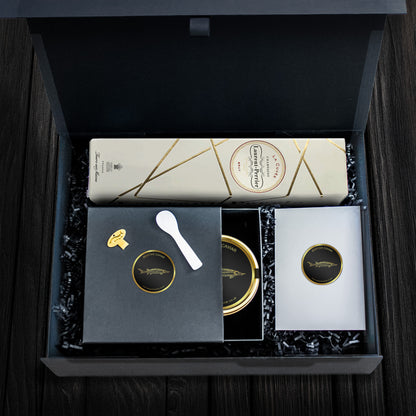 Dark hamper featuring Laurent St. Perrier Champagne, caviar tin, mother of pearl spoon and a caviar tin opener